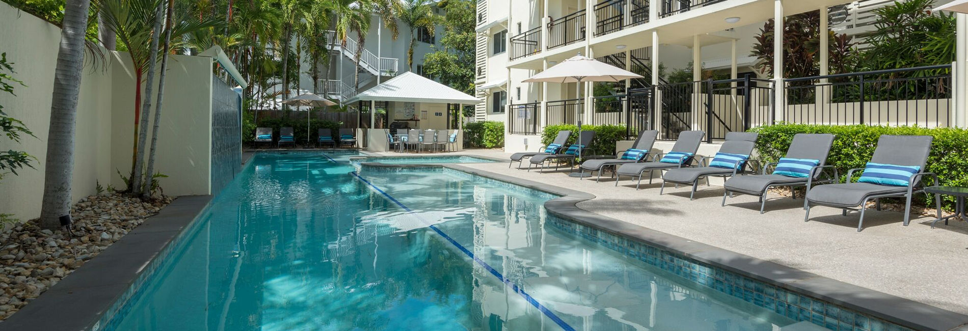 25m Heated Pool & Guest BBQ Area 25-metre heated outdoor swimming pool and BBQ entertainment area at Port Douglas holiday apartments